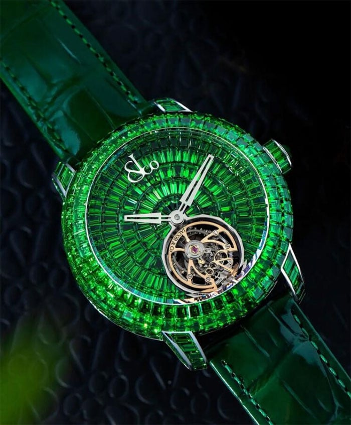 The watch is studded with emeralds.