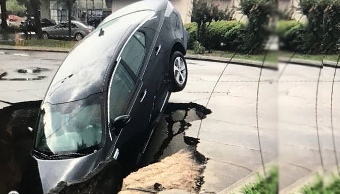 A vehicle fell into a deep crack on the road in Lahore