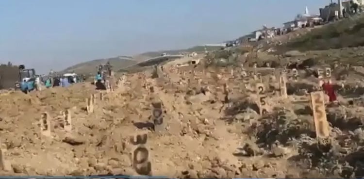 Thousands of unmarked graves of those who died in the earthquake