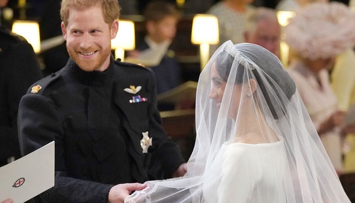 Why was Queen Elizabeth surprised that Meghan wore white to the wedding? File photo