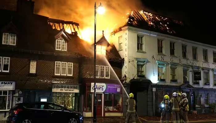 A fire broke out in a 400-year-old hotel in southern England A fire broke out in a 400-year-old hotel in southern England