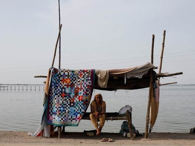 'Climate Change Bomb Is About to Explode,' United Nations A woman sits in a makeshift shelter after the devastating floods of 2022 in Pakistan. Photo: The Express Tribune