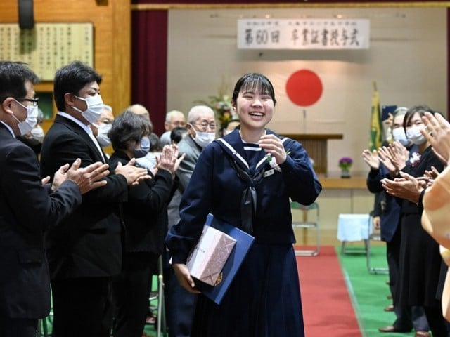 The only female student of a school built on a Japanese island has completed her graduation The only female student of a school built on a Japanese island has completed her graduation