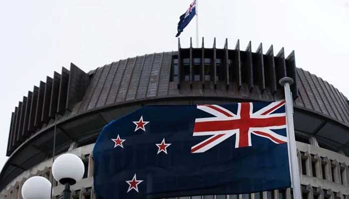 Some countries are interfering with our democracy and civil society, New Zealand A flag flies outside the New Zealand Parliament.