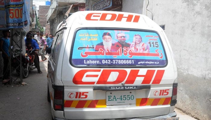 In Orangi Town, a man and a woman riding a motorcycle fell into the gutter In Orangi Town, a man and a woman riding a motorcycle fell into the gutter