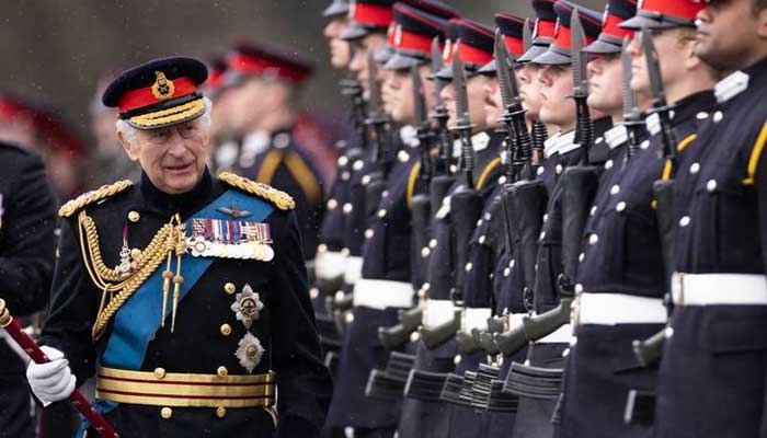 King Charles attends Sandhurst Academy parade for first time since coronation King Charles inspects the Swim Guard of Honour.