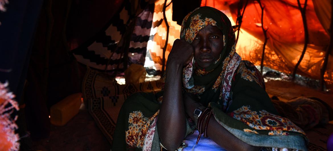 Ruqia Mohamud, a mother of eight, sits inside the shelter she shares with her children at a displaced persons site in Galkayo, Somalia. Ruqia Mohamud, a mother of eight, sits inside the shelter she shares with her children at a displaced persons site in Galkayo, Somalia.