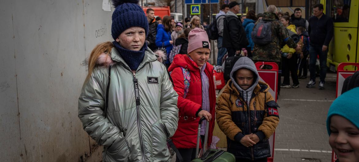A group of mainly women and children arrive in Kyiv in April 2022 after being evacuated from the southern city of Mykolaiv. A group of mainly women and children arrive in Kyiv in April 2022 after being evacuated from the southern city of Mykolaiv.