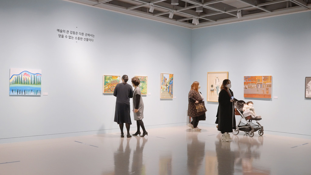 Visitors take in an art show in Seoul, Republic of Korea.