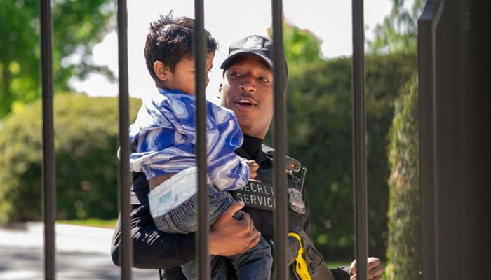 A toddler walks into the White House