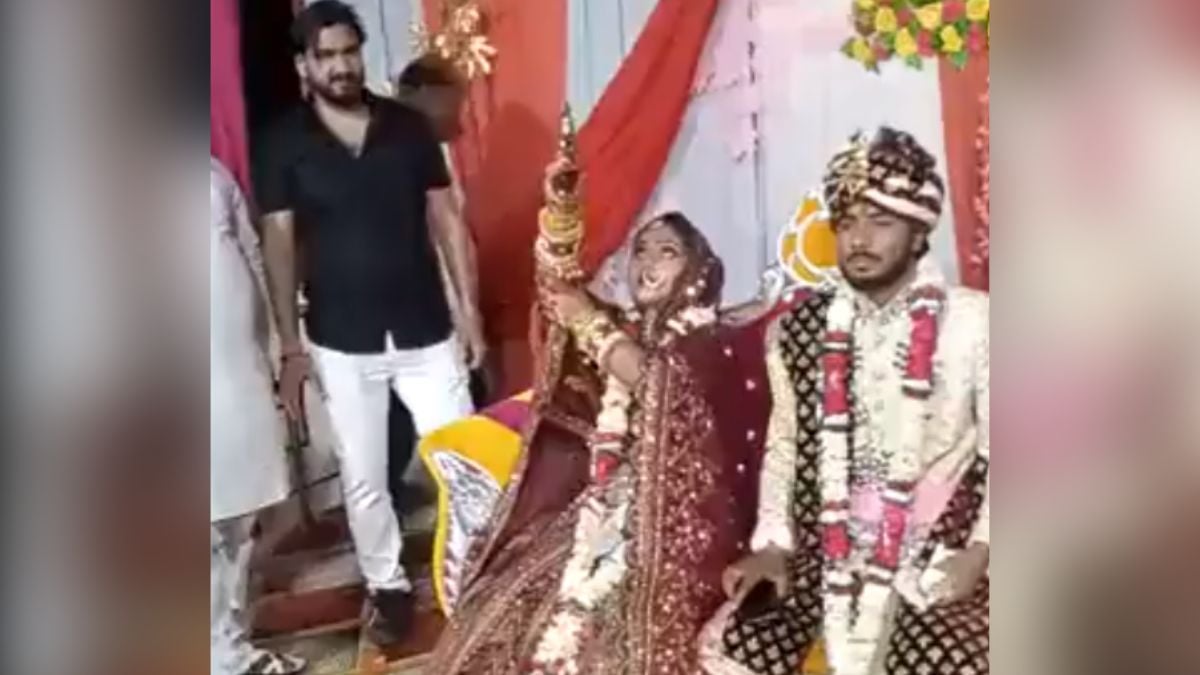 In India, the bride sitting on the stage, firing in joy