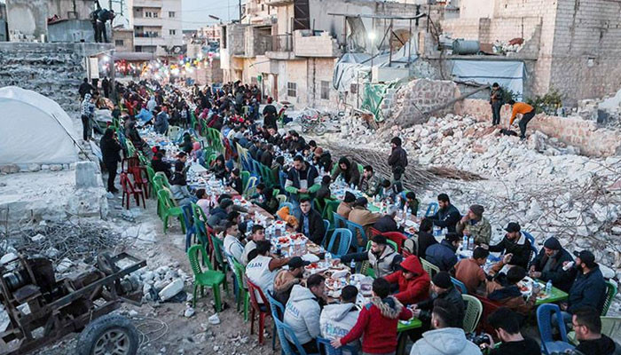 In Syria, pictures of earthquake victims sharing Iftar among the rubble went viral