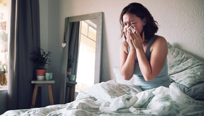 Why do some people sneeze when they wake up in the morning?