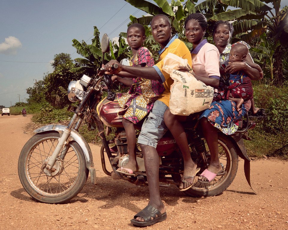 Over-loaded vehicles, like this motorcycle taxi in Benin, are a major cause of road traffic accidents in the developing world. (file)