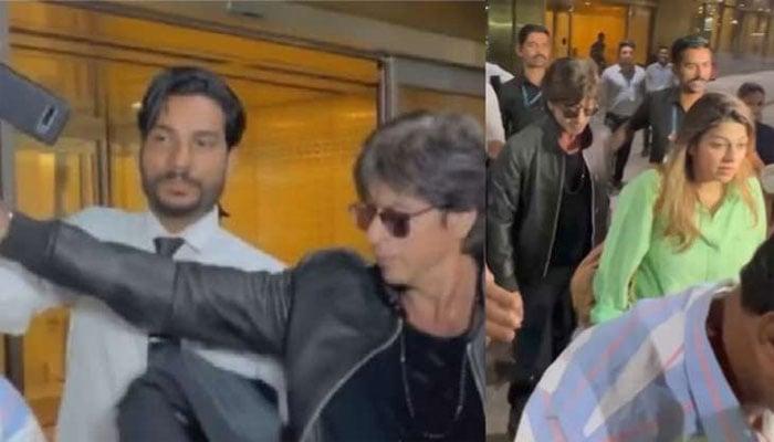 Shaking a fan's hand while taking a selfie cost Shahrukh Khan dear Screen grab