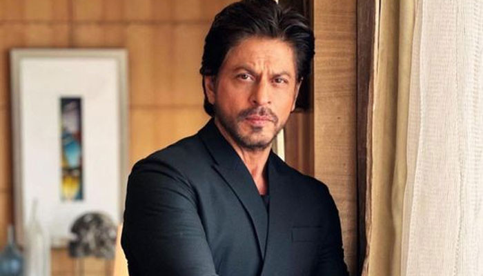 Shah Rukh Khan was troubled by the growing fame of which actor?