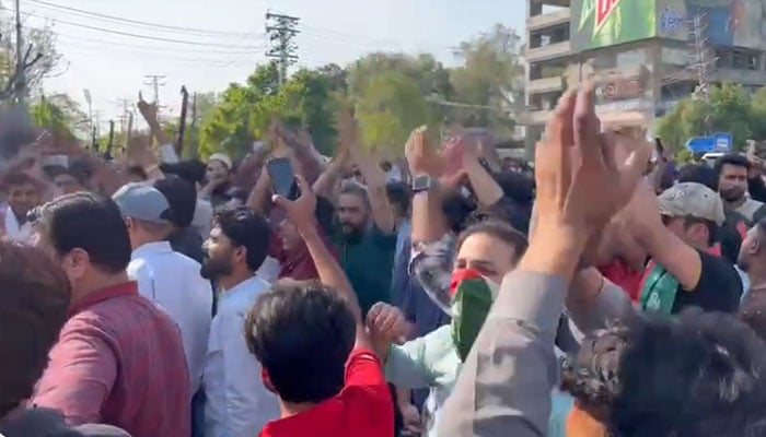 On whose order was Imran Khan arrested? PTI workers protest at Liberty Chowk, photo courtesy of Twitter (screen grab)