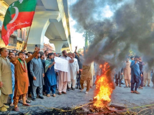 PTI protesters attacked the Provincial Election Commission office in Peshawar The workers smashed all the computers in the office, the big screen in the conference room. Photo: File