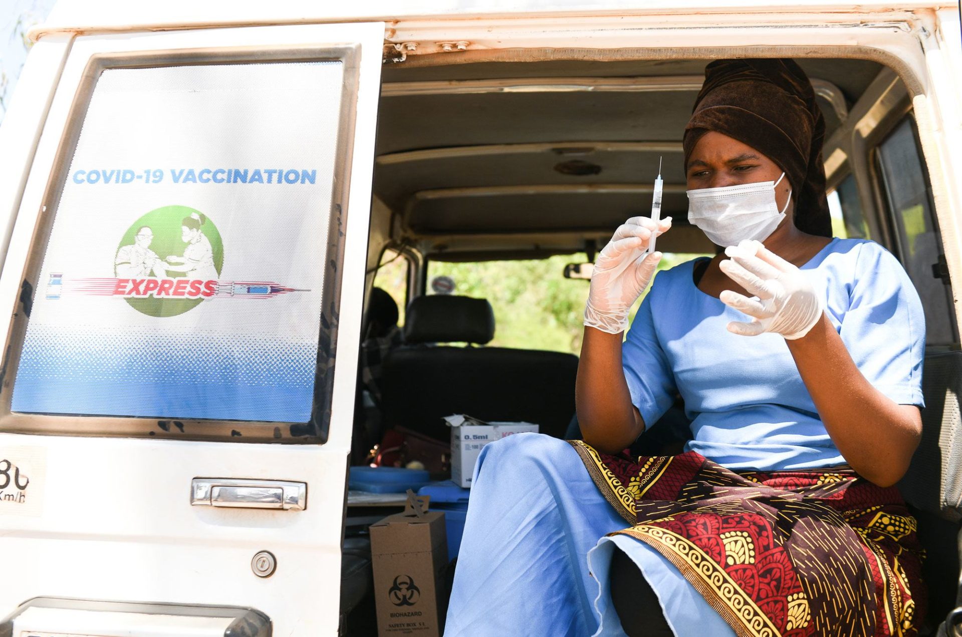 A health worker prepares to administer COVID-19 vaccines at a village in Kasungu, Malawi. A health worker prepares to administer COVID-19 vaccines at a village in Kasungu, Malawi.