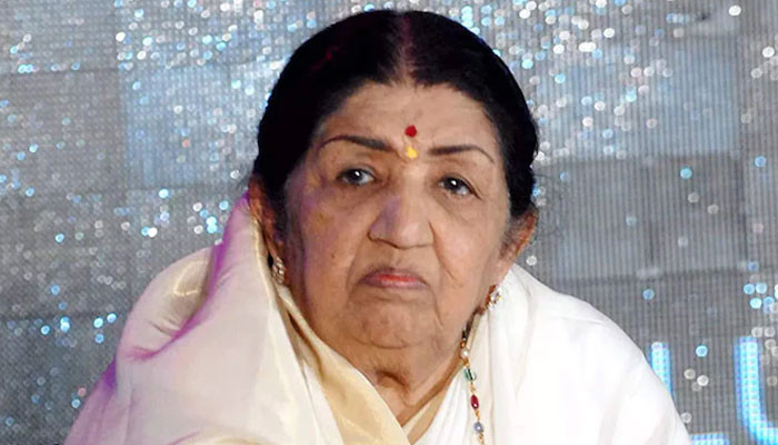 Who gave food poisoning to Lata Mangeshkar?