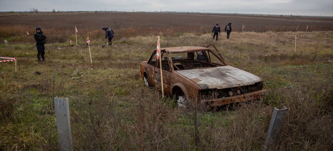 Deminers clear a previously occupied area near the front line between Mykolaiv and Kherson in southern Ukraine.