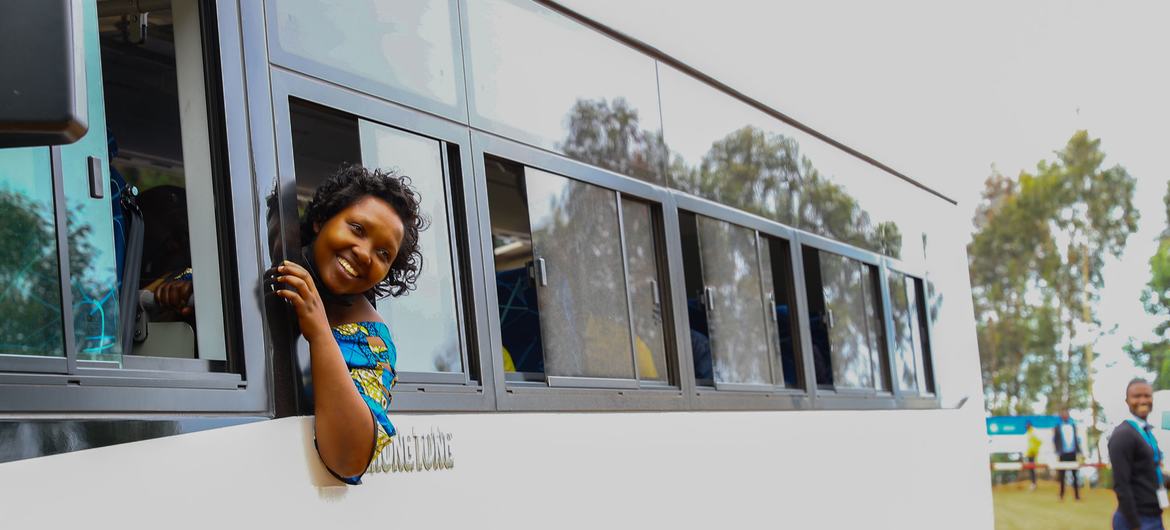 A woman leaves a refugee camp in Rwanda on her way to resettlement in Norway. A woman leaves a refugee camp in Rwanda on her way to resettlement in Norway.