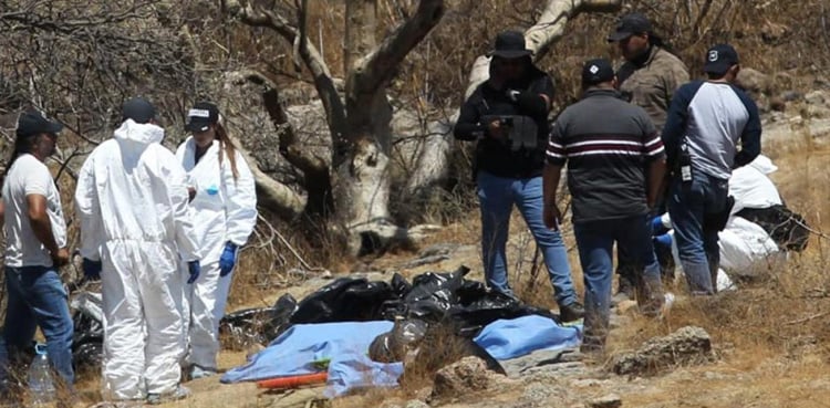 6 mutilated bodies were recovered from the hill