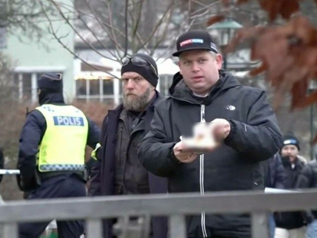 A copy of the Holy Quran is burnt outside the Eid Gah in Sweden