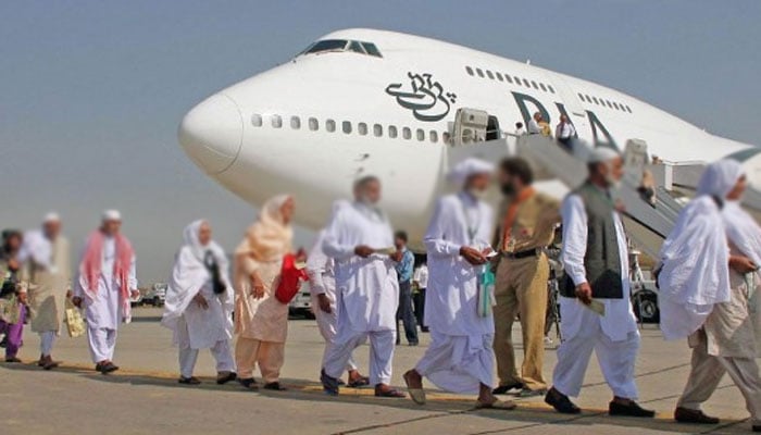 Pilgrims return home, PIA's first flights reach Lahore, Karachi Pilgrims return home, PIA's first flights reach Lahore, Karachi