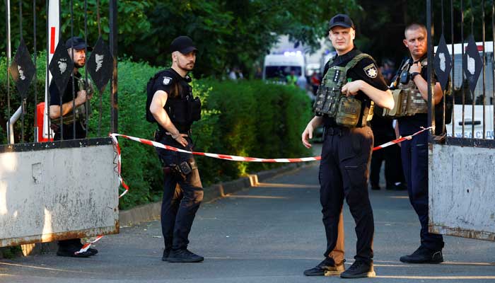 Police personnel are present outside the court after the explosion.