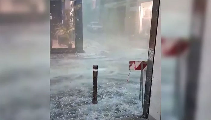 After intense heat, hail and heavy rain, roads turned into rivers, 100 people injured Image Courtesy: EuroNews.com