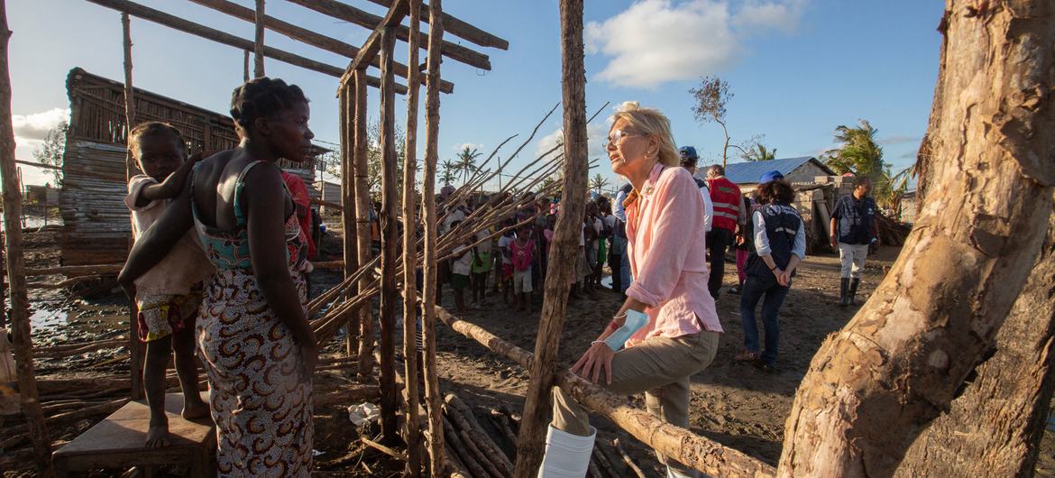 UN Resident Coordinator Myrta Kaulard talks with people affected by Cyclone Freddy in Quelimane, Zambezia province, Mozambique. Freddy, the highest energy-producing tropical cyclone ever recorded worldwide, hit the country twice in the beginning of 2023.