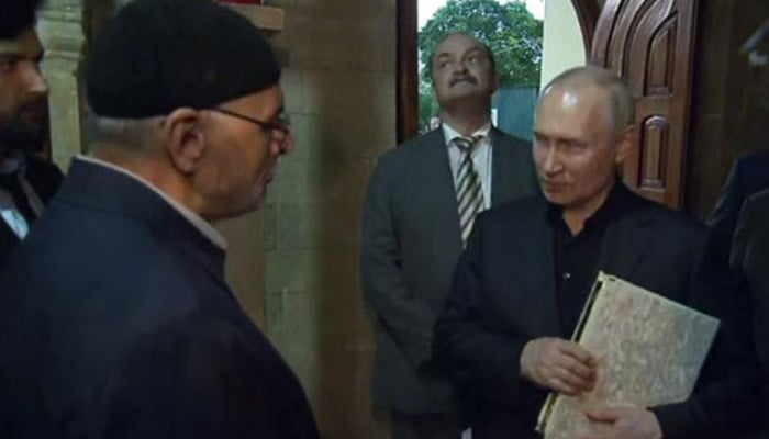 Russian President Vladimir Putin hugged the Holy Quran