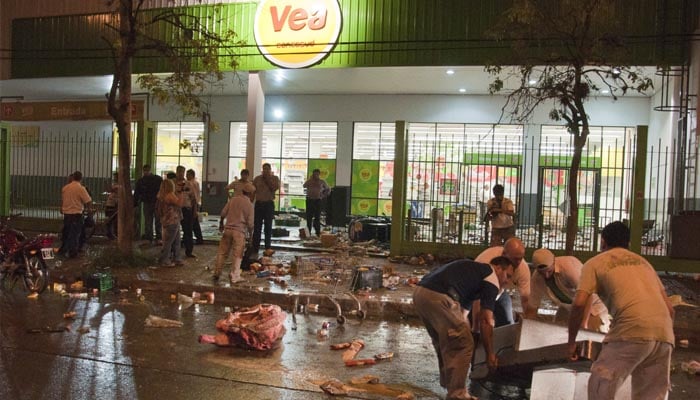 In the worst economic crisis in Argentina, people started looting because of inflation Citizens stormed a grocery store in Argentina, leaving food and drink strewn on the street.