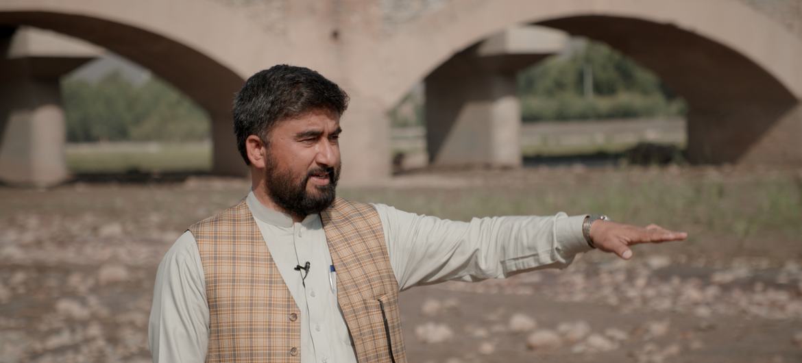 UNODC’s Hidayatullah Sapi standing on the banks the drying “Red River” in the eastern region of Afghanistan.