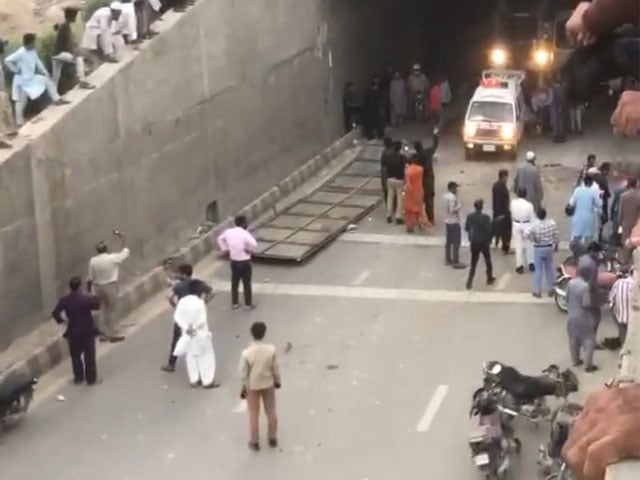 A motorcyclist was killed and 2 injured after a signboard fell in Nazimabad underpass