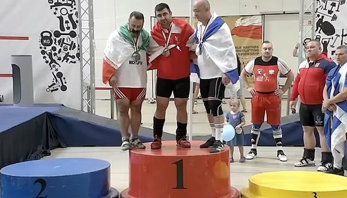 Iran bans weightlifter for life for shaking hands with Israeli athlete