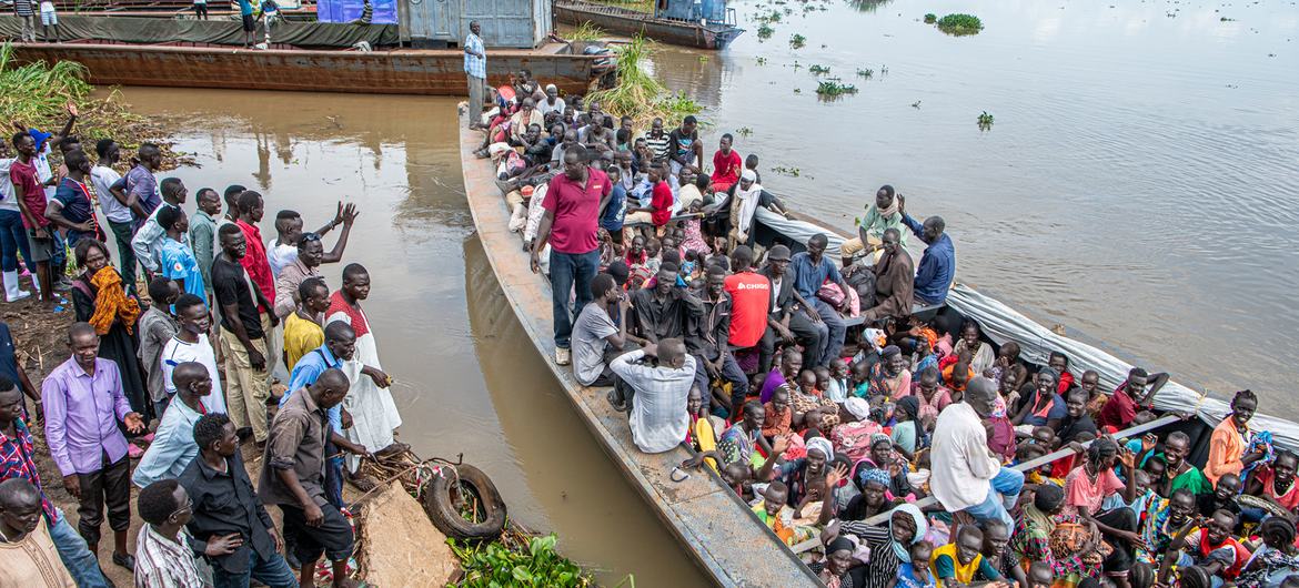 A barge leaves a pier in Renk, Upper Nile State, South Sudan, carrying hundreds of South Sudanese returnees who have fled the conflict in Sudan. A barge leaves a pier in Renk, Upper Nile State, South Sudan, carrying hundreds of South Sudanese returnees who have fled the conflict in Sudan.