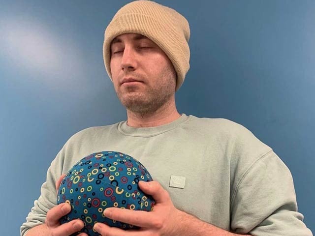 British scientist, Alex Farrell is demonstrating this in practice with a mental health improvement ball.  Photo: Courtesy of Medical News Network 