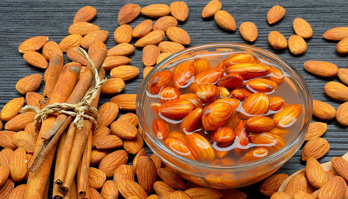 What are the effects of eating soaked almonds on the body?