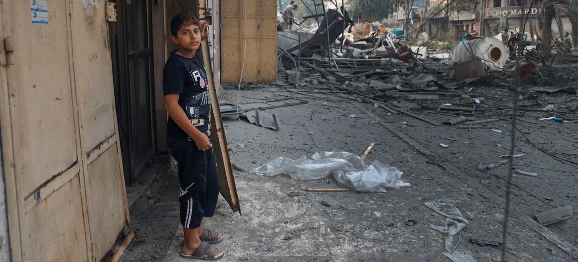 An 11-year-old boy stands at the entrance to his home in Gaza City. An 11-year-old boy stands at the entrance to his home in Gaza City.