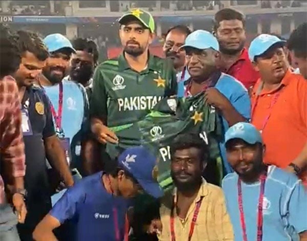 Photo of captain Babar Azam with ground staff