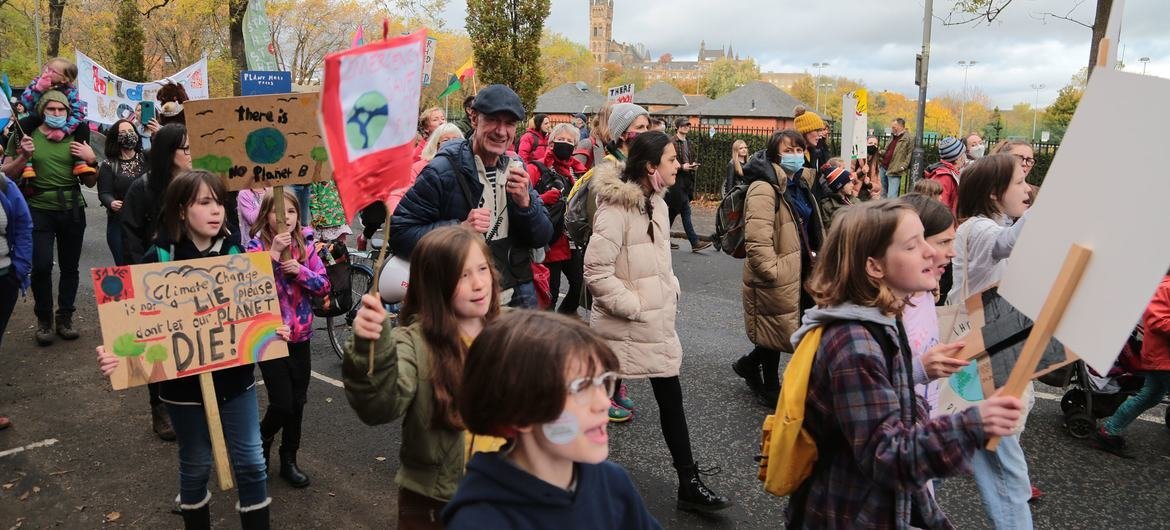 In Glasgow, Scotland, people take part in a demonstration for climate action, led by youth climate activists and organized on the sidelines of the 2021 UN Climate Change Conference (COP26). In Glasgow, Scotland, people take part in a demonstration for climate action, led by youth climate activists and organized on the sidelines of the 2021 UN Climate Change Conference (COP26).
