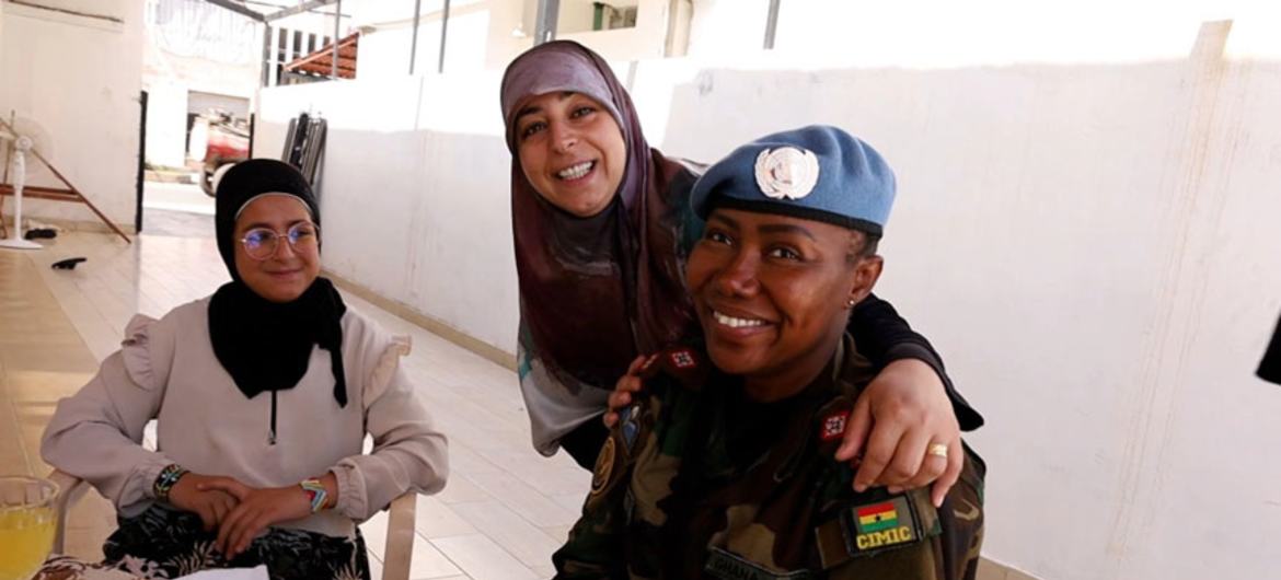 Captain Baah (right) visits a Lebanese family in Southern Lebanon.