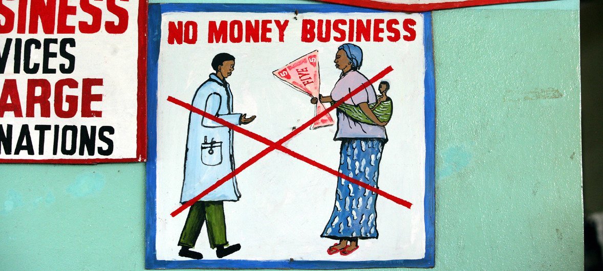 A sign outside a hospital in the Liberian capital, Monrovia, urges patients not to bribe doctors or other staff for any services. The UNICEF-supported hospital offers its services for free.