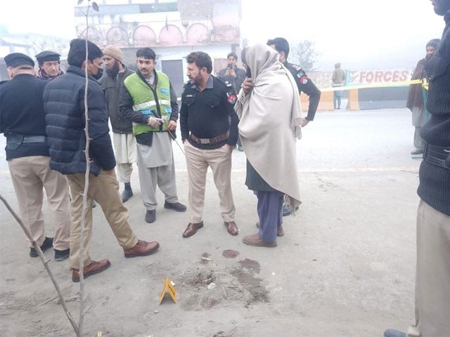 A policeman and a government officer were killed in the firing incident in Peshawar Checks on blockades across the city have been tightened.