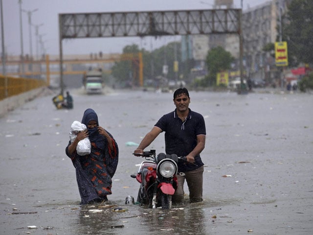 Two people died due to electrocution and drowning in a drain during rain in Karachi