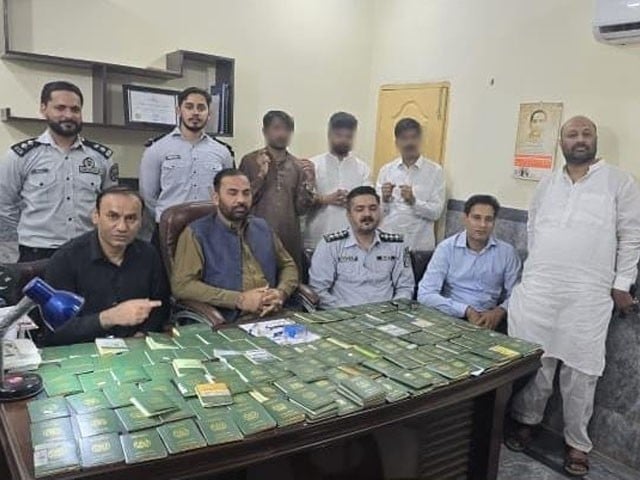 Hundreds of passports recovered from medical lab in Lahore Photo: Express