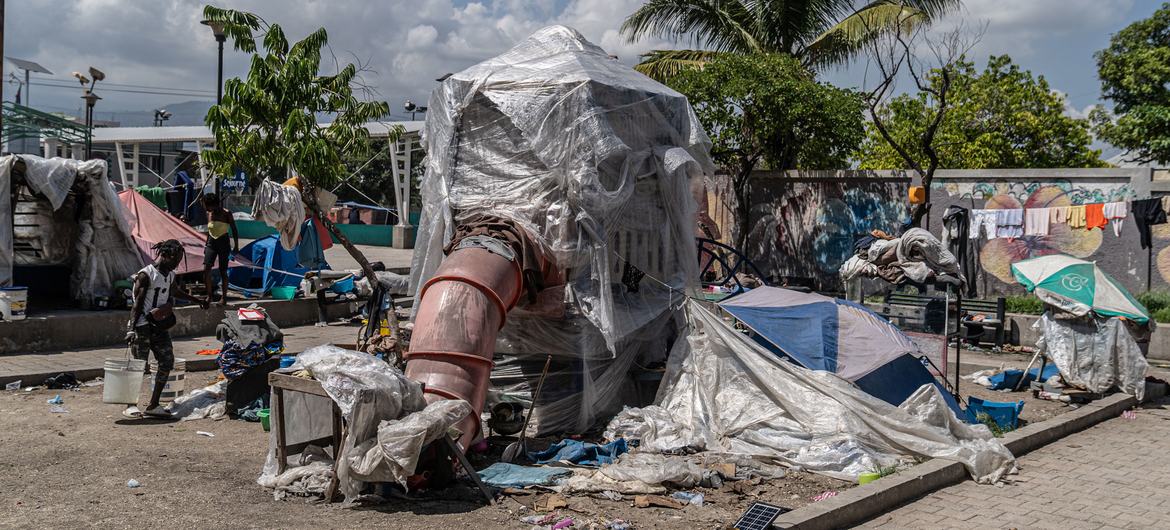 A children’s playground structure becomes a shelter for people in the Tabarre area of Port-au-Prince, Haiti.