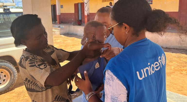 A baby is weighed at the primary health care centre in Behara. A baby is weighed at the primary health care centre in Behara.